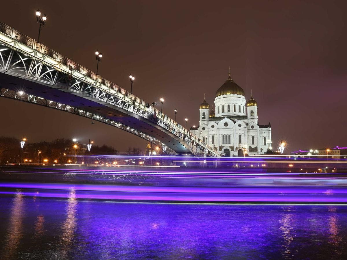 Garden Sanctuary bedroom with hand-carved teak and linen furnishings