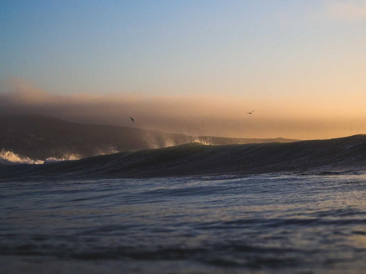 Open-air bathroom with soaking tub on the villa deck