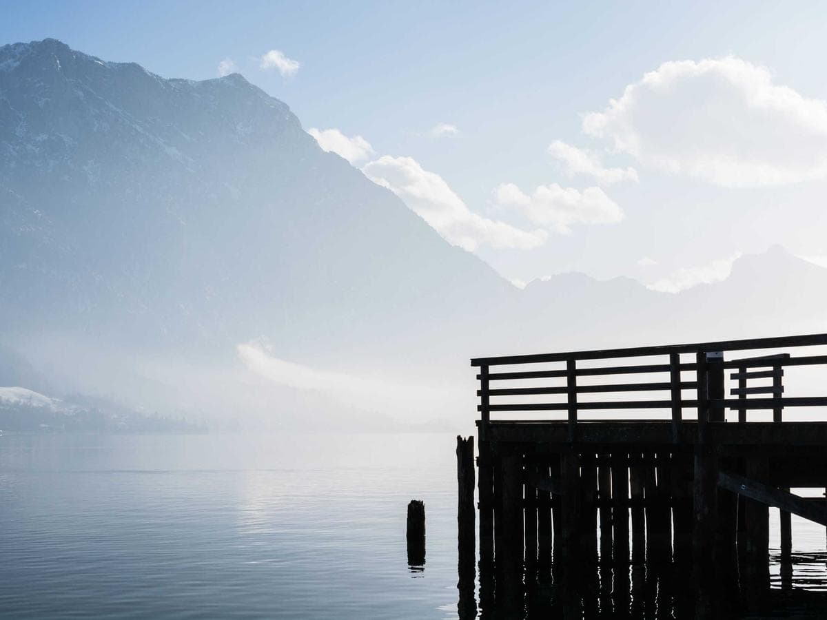 Beach Suite interior with coral-stone walls and woven rattan furnishings