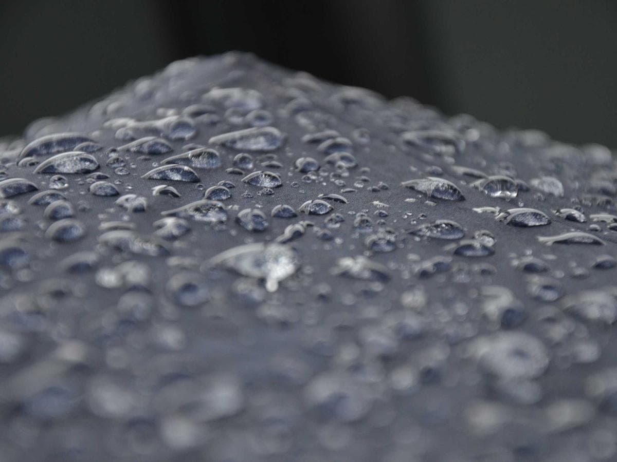 Outdoor rain shower on the Beach Suite terrace with palm canopy